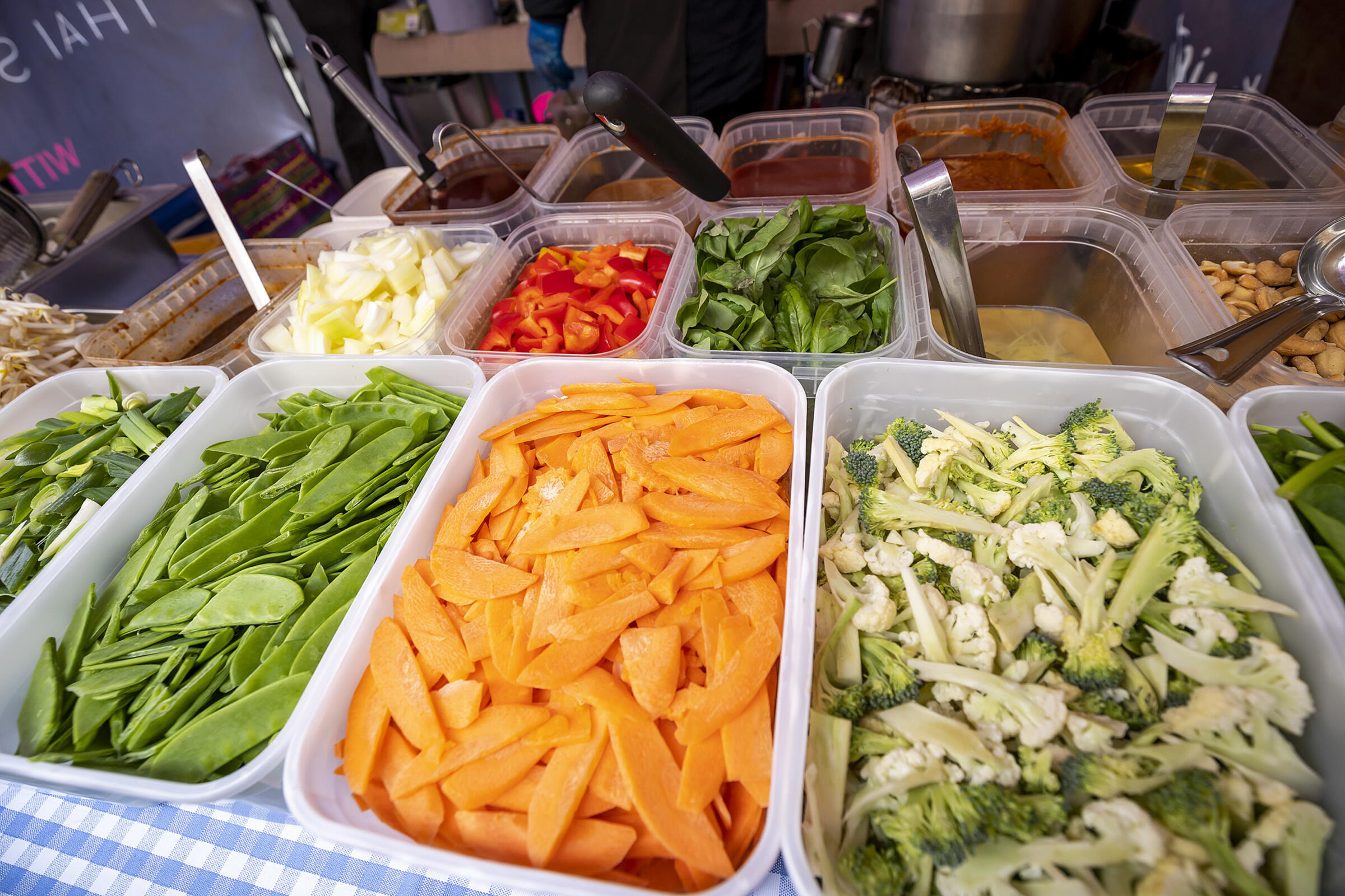 Trays of sliced vegetables for stir fry