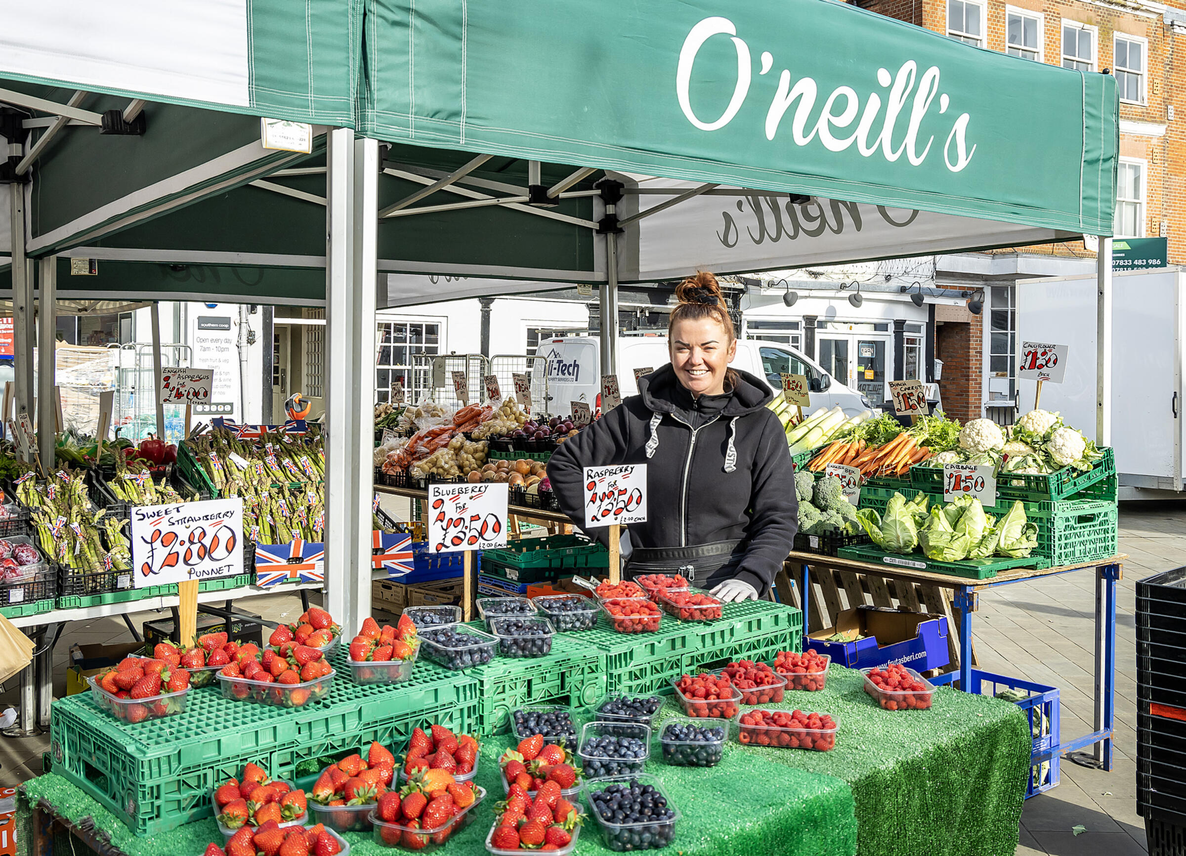 Trader with fresh fruit and vegetables