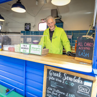 Trader at a counter on a food stall