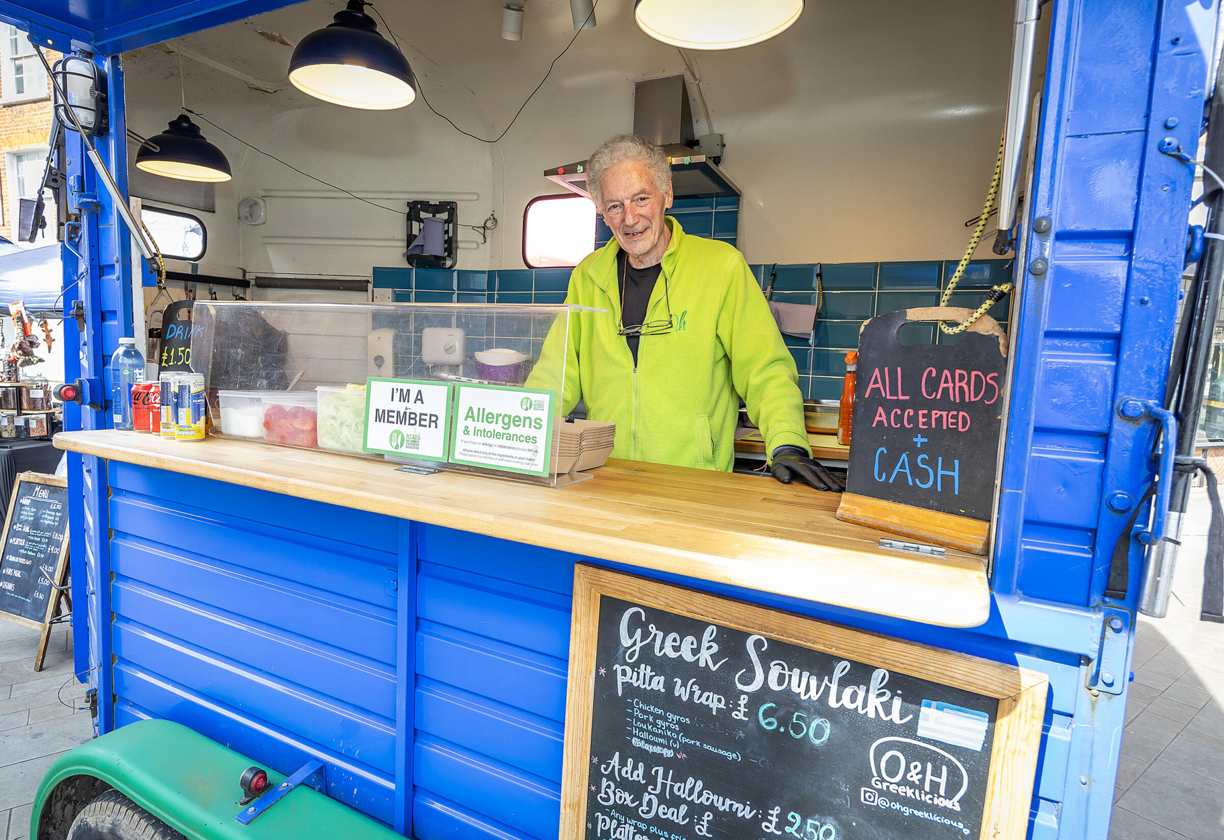 Trader at a counter on a food stall